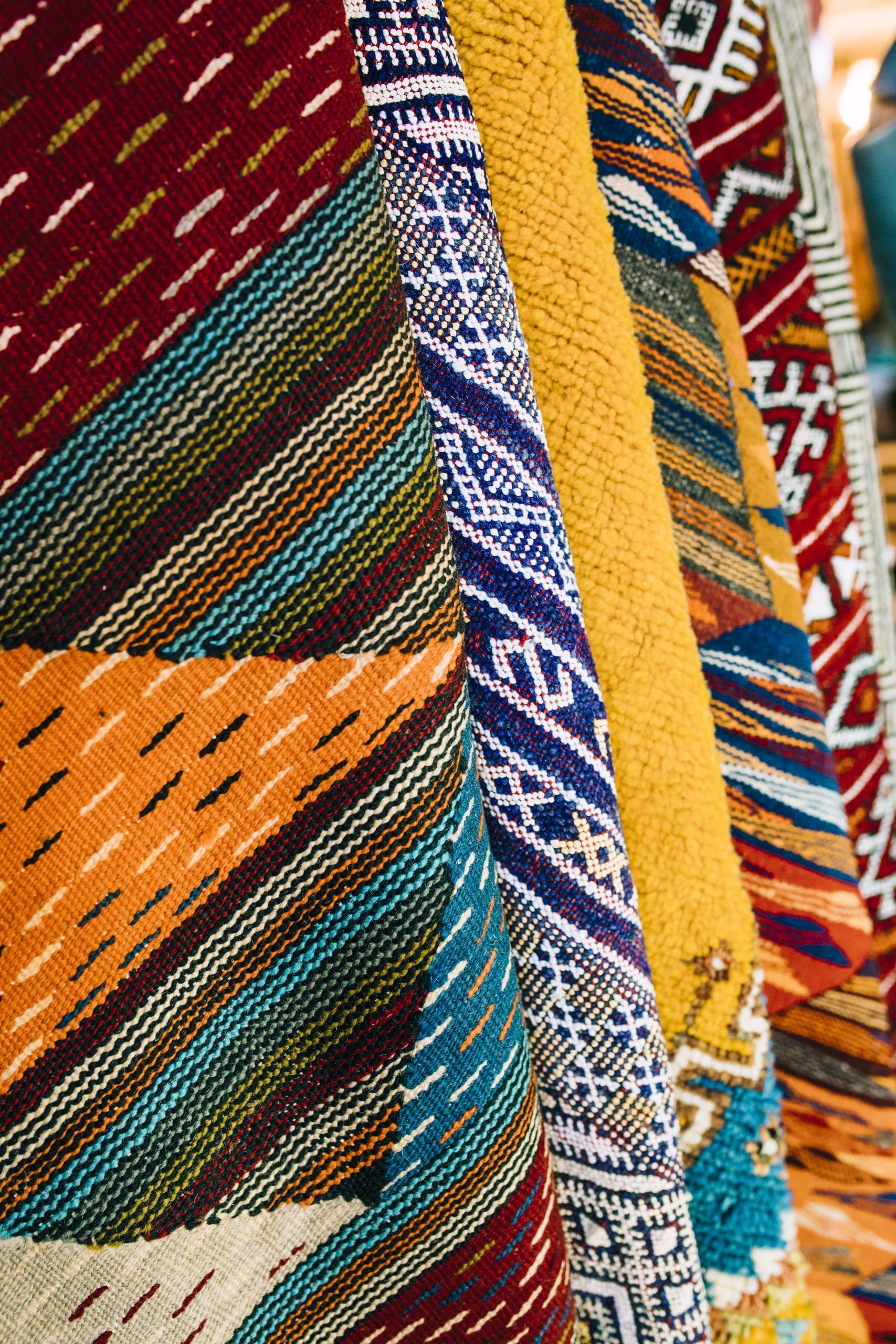 Close-up of colourful striped woven rugs