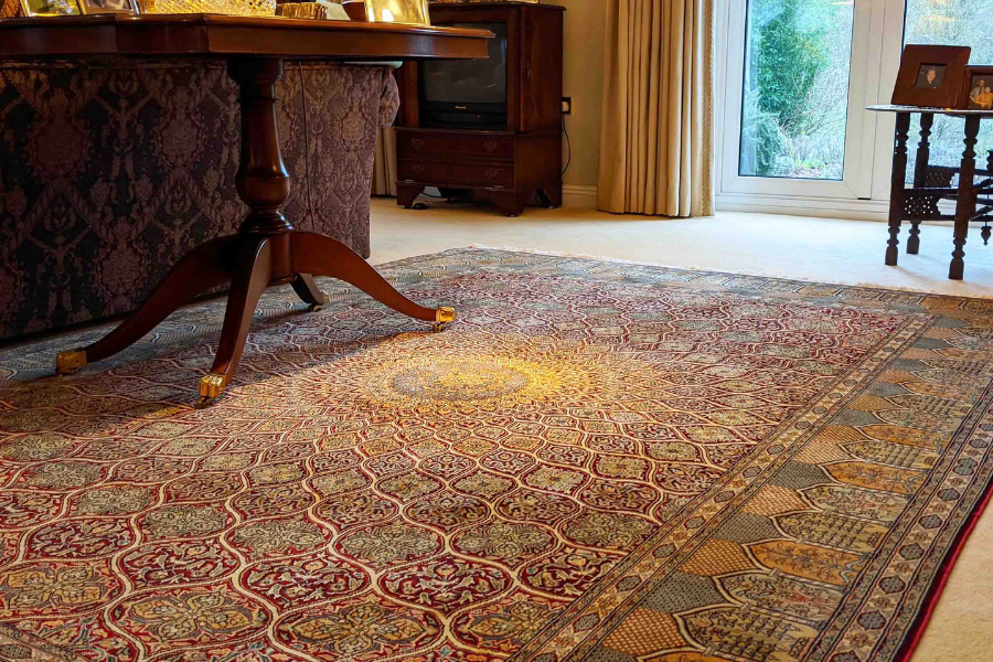 Antique medallion silk rug in a living room