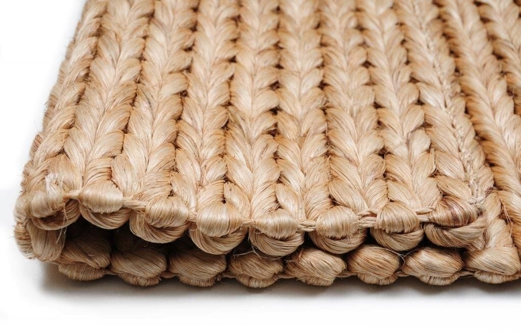 Close-up of a tightly braided natural fibre rug edge