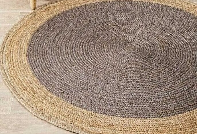Round rug with a grey centre and tan braided border