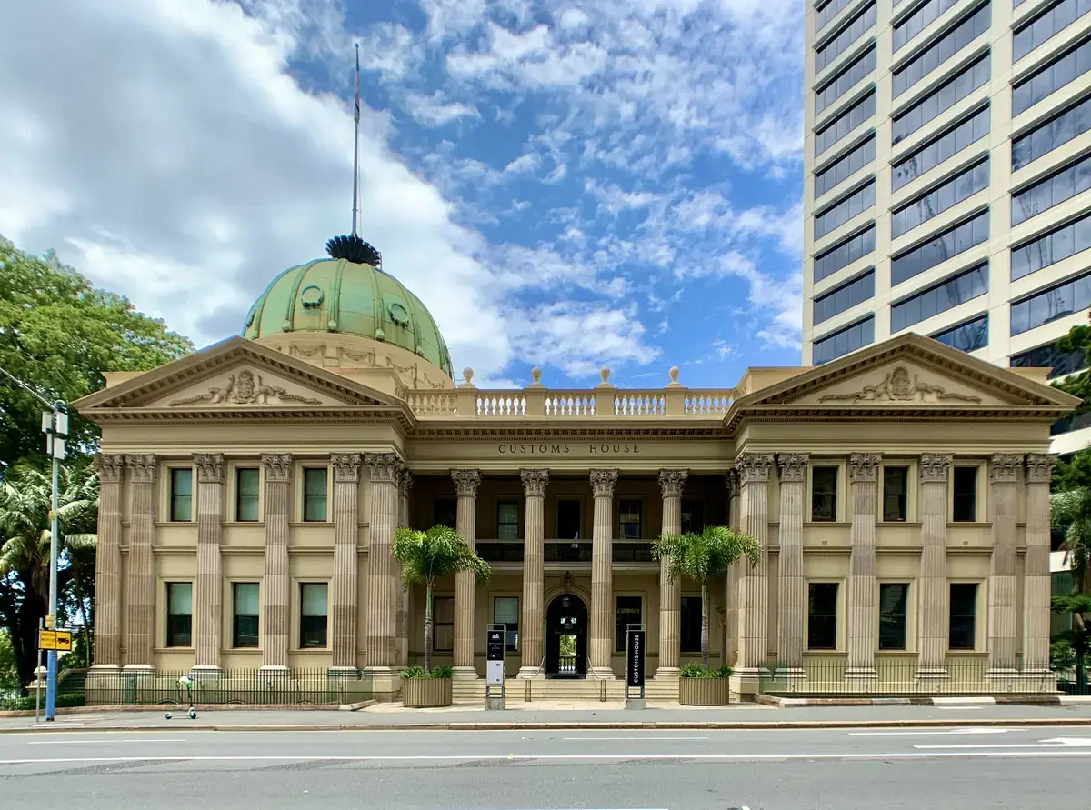 The copper dome and columns of Customs House on the riverbank