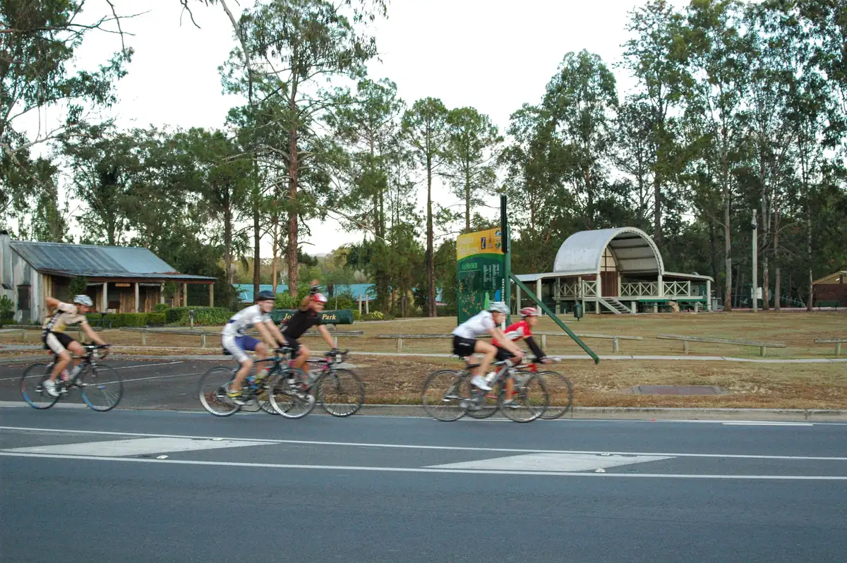 Samford's main street with cyclists passing John Scott Park