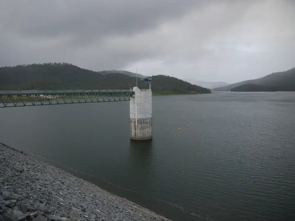 The spillway tower standing in Advancetown Lake at Hinze Dam