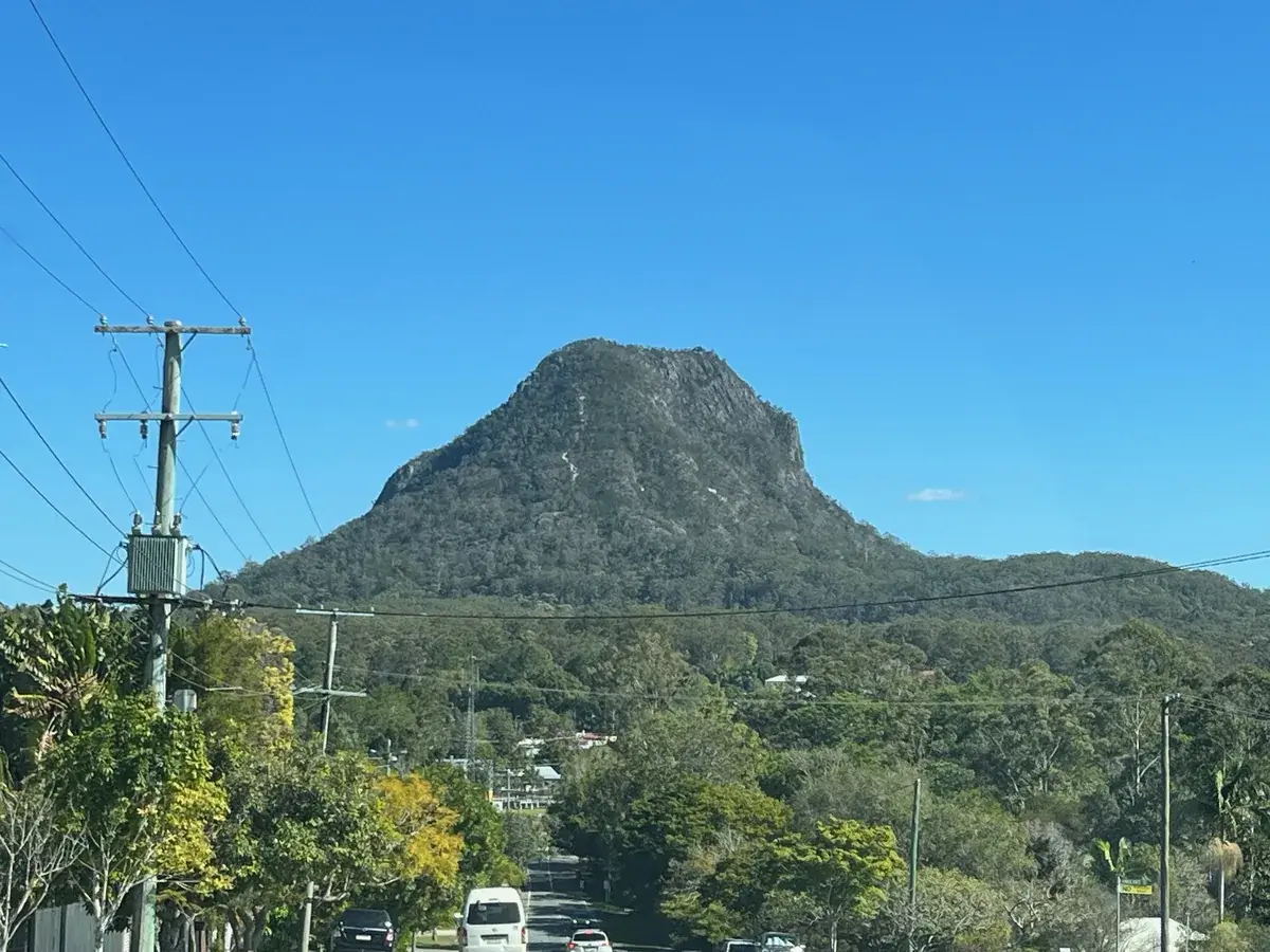 Mount Cooroora's rock face above the town of Pomona