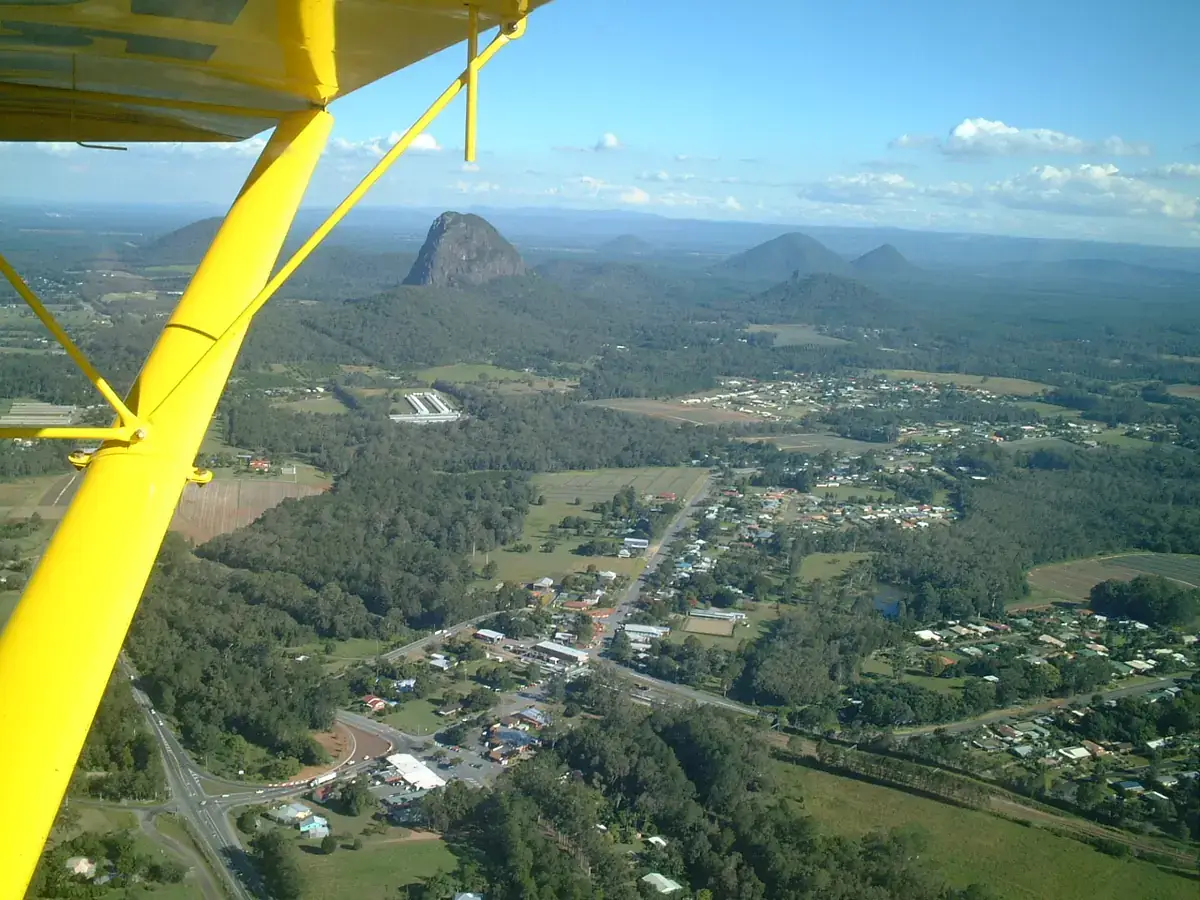 The Glass House Mountains rising out of farmland, seen from the air